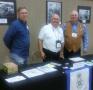 Photograph: [TXSSAR Members at a Booth]