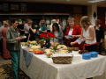 Photograph: [Party Guests Around Buffet at New Faculty Reception]