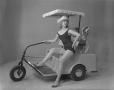 Photograph: [Model in Golf Cart]