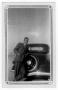 Photograph: [Louis De Wolf Standing Beside a Car]
