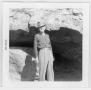 Photograph: Earle Wilcoxson Standing in Front of Sam Bass Cave