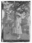 Photograph: Unidentified Girl Standing in a Cemetery