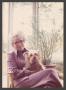 Photograph: [Charlyne Creger and Dog by Windows]