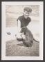 Photograph: [Charlyne Creger Sitting with Dog]