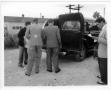 Primary view of [Loading a casket into a hearse before the mass funeral service for victims of the 1947 Texas City Disaster]