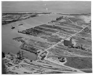 Primary view of object titled '[Aerial view of the port facilities and the grain elevator after the 1947 Texas City Disaster]'.