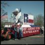 Primary view of [Two People by Texas Sesquicentennial Parade Float]