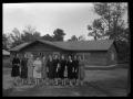 Primary view of [Women in Front of Log Cabin]