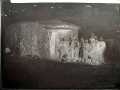 Photograph: Negative film of a sod school house with students.