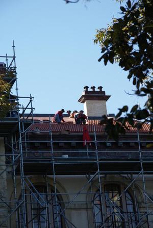 Primary view of object titled '[Men On Top of Roof]'.