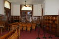 Photograph: [Folded Chairs in Courtroom]