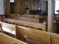 Photograph: [Benches in a Courtroom]
