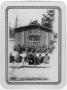 Photograph: [Men and boys gather at the CCC camp building]