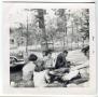 Photograph: [Lufkin Trail Riders Club Members Sitting Outside]
