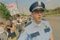 Primary view of [Close Up of Police Officer Accompanying Group at AIDS March]