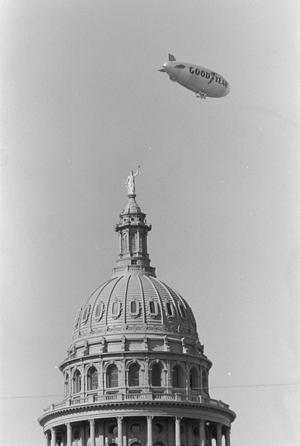 Primary view of object titled '[Blimp Flying Over Texas Capitol, Number 1]'.