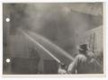 Photograph: [Firefighters Using Fire Hoses on Building]