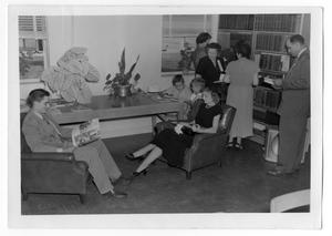 Primary view of object titled 'Unidentified People in Adult Section of the Denton City-County Public Library'.