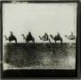 Photograph: Glass Slide of Line of Camels and Riders