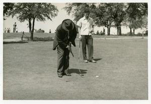 Primary view of object titled '[Golfers putting on green at Municipal Golf Course]'.