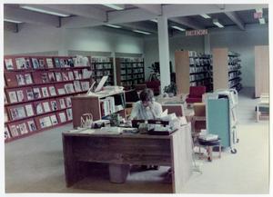Primary view of object titled 'Logan Ragsdale Working at the Denton Public Library'.
