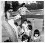 Photograph: [Diana Gonzalez reads to children in the Emily Fowler Library Tree Ho…