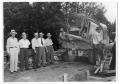 Photograph: Several Men Standing Near a Baker-Floyd Cement Truck