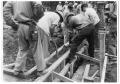 Photograph: [Unidentified men working on an unknown construction site]