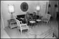 Photograph: [Ernest and Margaret Medders Sit in Furnished Room]