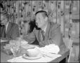 Photograph: [Will Rogers Jr. At Table]
