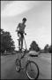Photograph: [Boy Rides Tall Bicycle]