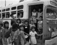 Primary view of [Children Entering a Bus]