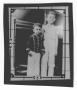 Photograph: [Two Boys Standing by an Automobile]