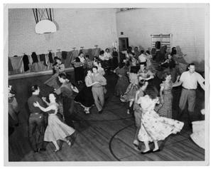 Primary view of object titled 'Squaredancing in Unidentified School Gymnasium'.