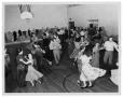 Thumbnail image of item number 1 in: 'Squaredancing in Unidentified School Gymnasium'.