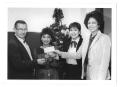 Photograph: [Photograph of Faculty Celebrating Christmas]