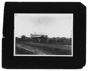 Primary view of object titled '[Dirt Road in Front of Building]'.