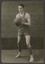 Primary view of [Male Basketball Player Holding a Basketball]