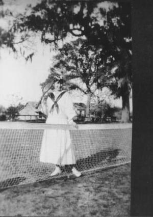 Primary view of object titled '[Photograph Of Etha Savage Johnson On A Tennis Court]'.