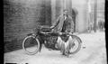 Photograph: [Man Standing with Motorcycle and Fish #3]