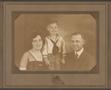 Photograph: [Photograph of a Man, Woman, and Young Child]
