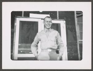 Primary view of object titled '[Donald Tschirhart Outside Barracks]'.