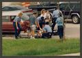 Photograph: [Paramedics Tend to Patient on Stretcher]