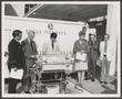 Photograph: [Photograph of Six People With an Incubator]