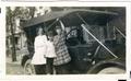 Primary view of [Children on the running board of a motor car]