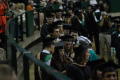 Photograph: [Students at Masters Commencement Ceremony]