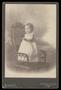 Primary view of [Portrait of a Child Standing on a Wicker Chair]