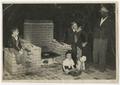 Photograph: [Sims McCutchan, III, John Sanders, and John Taylor by Barbecue Grill]