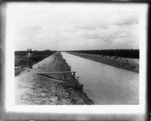 Primary view of object titled '[Photograph of Dirt Canal with Gate]'.