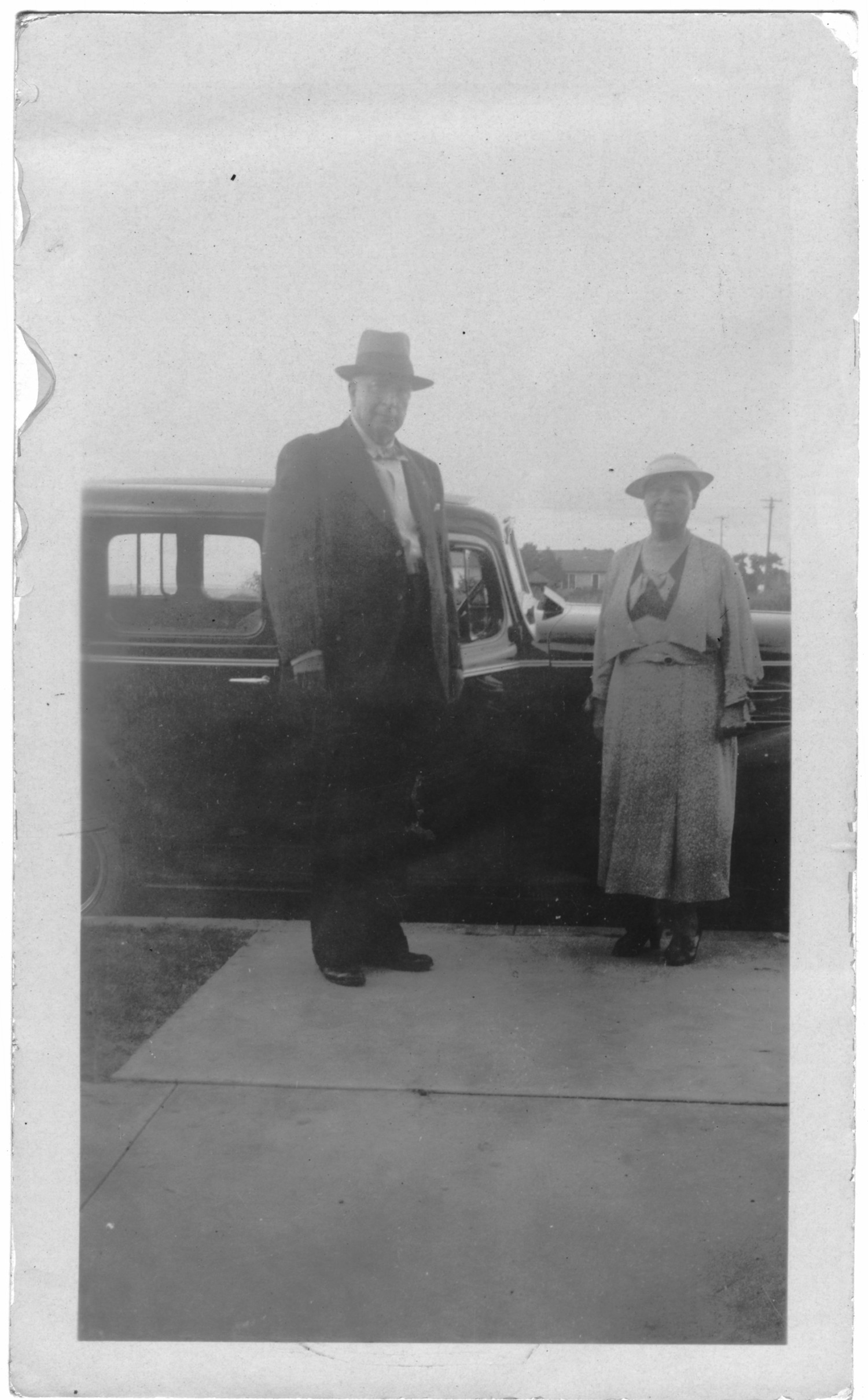 [Col. Hugh B. and Helen Moore standing in front of a car]
                                                
                                                    [Sequence #]: 1 of 1
                                                